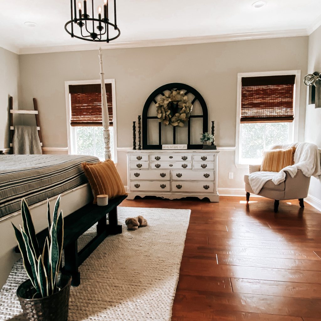 Farmhouse Master Bedroom with a cozy chair for reading or enjoying your morning coffee. | The Yellow Rose Farmhouse | www.theyellowrosefarmhouse.com