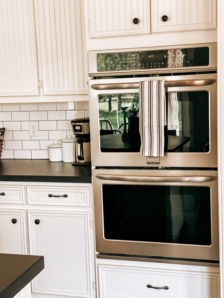 The Yellow Rose Farmhouse Kitchen Remodel details with Frigidaire double ovens built into cabinets