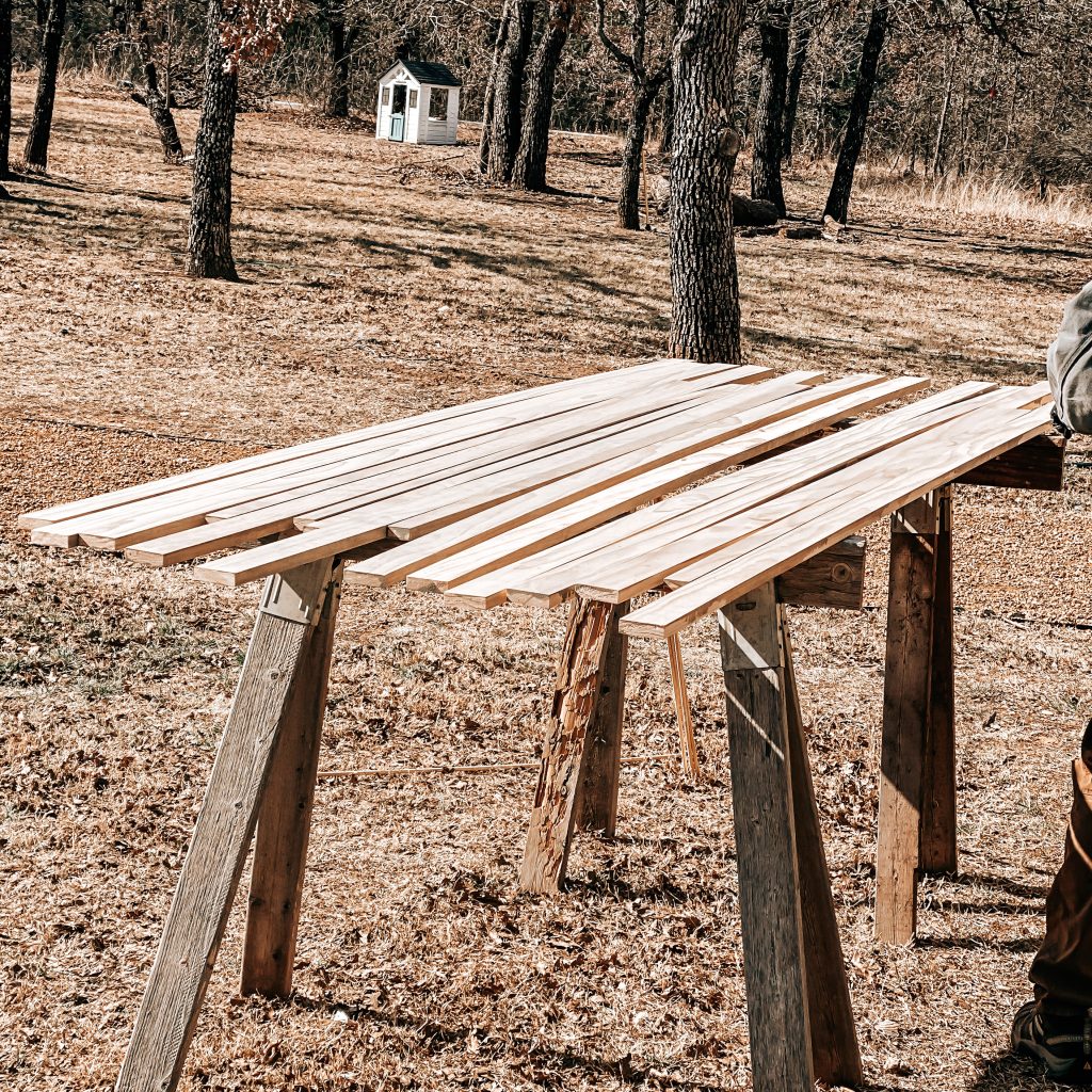 The boards ready to be stained for the wood slat accent wall with shelves | The Yellow Rose Farmhouse | www.theyellowrosefarmhouse.com