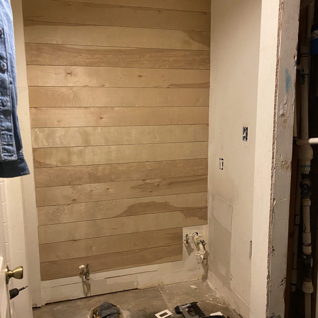 Modern Farmhouse Bathroom Remodel before picture of putting up floor underlayment to look like shiplap | The Yellow Rose Farmhouse | www.theyellowrosefarmhouse.com